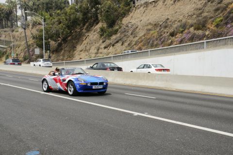 1993 Ford Taurus - A BMW Z8 convertible with Union Jack livery is seen on the highway.