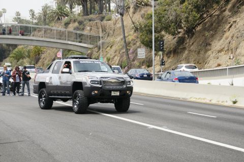 1993 Ford Taurus - A modified Chevrolet Avalanche participates in a rally on a sunny day.