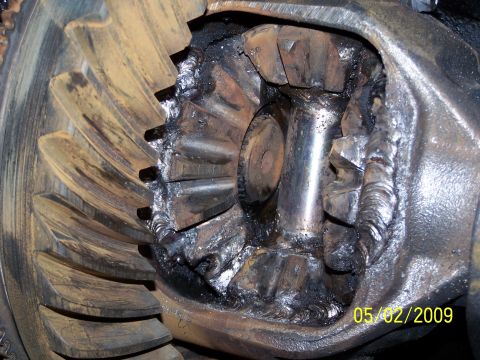 1989 Ford F-150 - Close-up view of severely damaged differential gears, showing signs of welding and wear.
