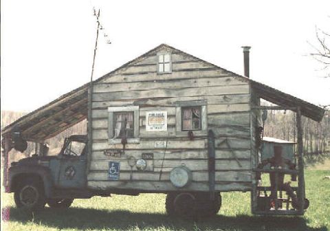 1983 Ford Bronco - This modified truck features a cabin structure built onto its chassis, resembling a small house on wheels.