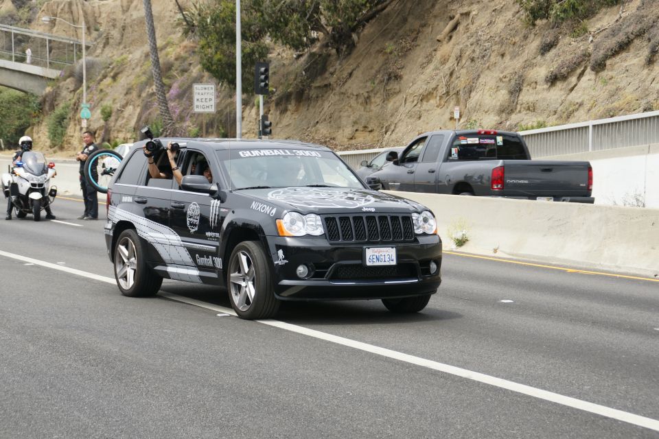 Black Jeep Grand Cherokee with Gumball 3000 decals and Nixon branding