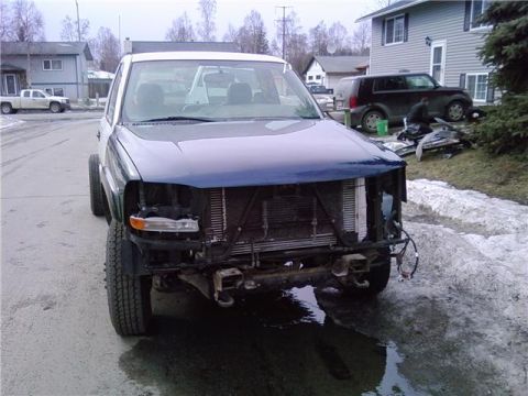 2001 Ford F-350 - Front view of a 2001 Ford F-350 with its front end disassembled.
