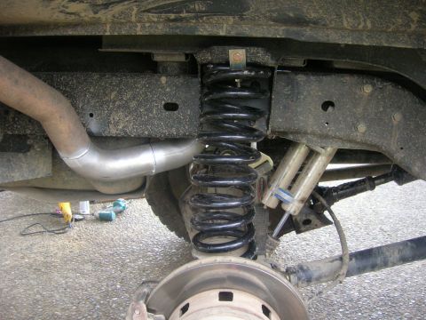 1996 Ford Bronco - Rear suspension components including coil spring and shock absorbers are visible in this close-up shot.