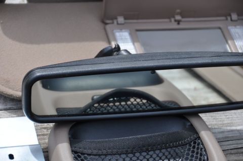 1996 Ford Bronco - Photo of an interior rearview mirror and console, not a technical document.