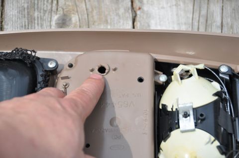 1996 Ford Bronco - Photo of an interior trim part being pointed at, not a technical document.