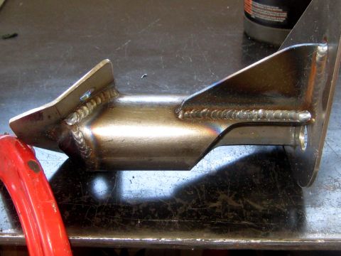 1996 Ford Bronco - A close-up view of a custom-fabricated metal suspension component, likely for off-road use.