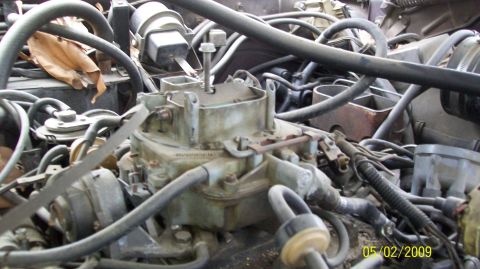 1972 Ford Ranchero - A close-up view of a carburetor and engine components in a vehicle, with various hoses and wires visible. A date stamp in the lower right c…