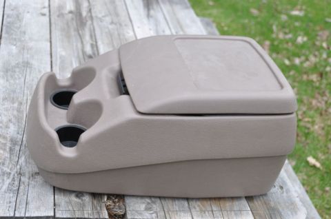 1996 Ford Bronco - Photo of a removed center console, not a technical document.