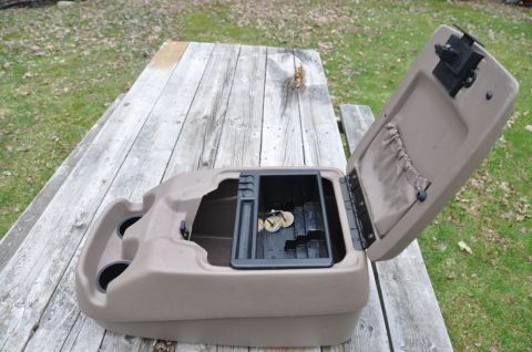 1996 Ford Bronco - Photo of an open center console, not a technical document.