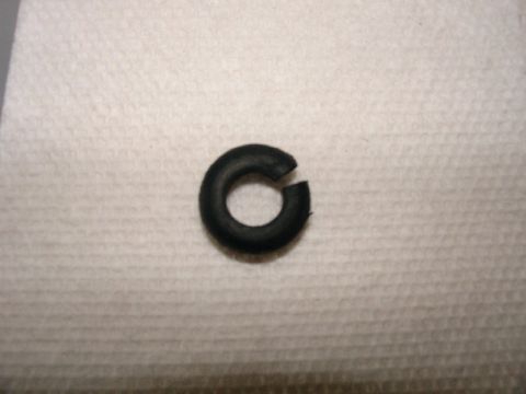 2003 Ford Crown Victoria - A single black rubber o-ring is shown against a textured white background.