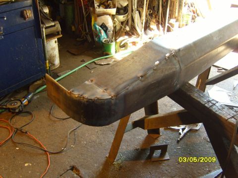 1989 Ford Bronco - Custom metal bumper fabrication in progress, showing welding and grinding work.