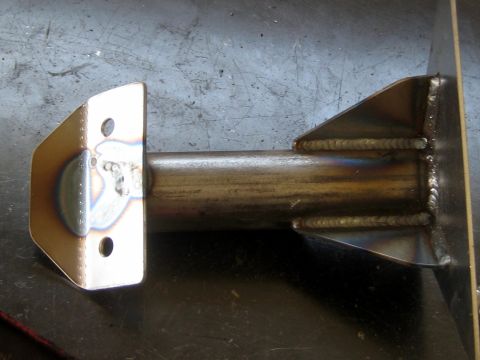 1996 Ford Bronco - A close-up view of a fabricated metal part, showing welds and mounting holes.