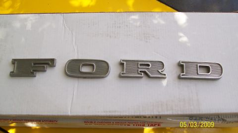 1972 Ford Ranchero - Individual metal letters spelling 'FORD' are shown, likely for a vehicle emblem.