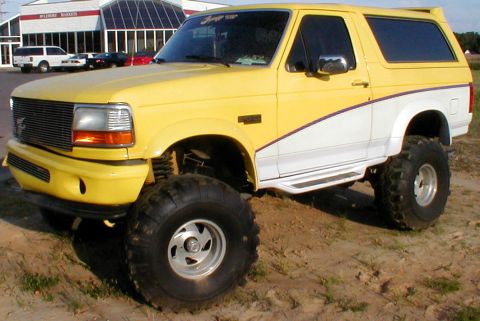 1983 Ford Bronco - This lifted Ford Bronco features a two-tone paint scheme and aggressive off-road tires.