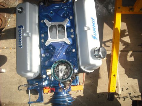 1982 Ford Bronco - A blue engine with Summit valve covers and an Edelbrock intake manifold is shown, possibly for a motor swap.