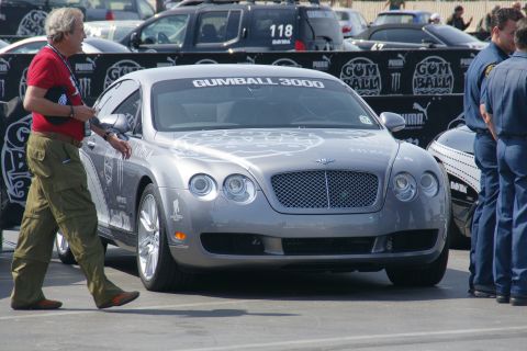 1993 Ford Taurus - A Bentley Continental GT is seen with a Gumball 3000 banner on its windshield.