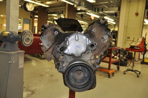 1996 Ford Bronco - Engine on a stand, showing the front of the block and pulley system.