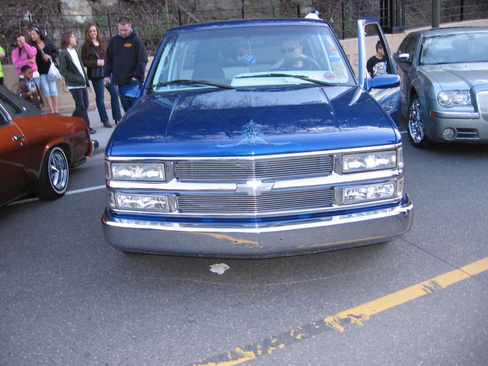 Blue 2001 Chevrolet Silverado 1500 front view with chrome grille and custom hood graphic