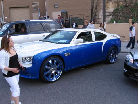 2001 Chevrolet Silverado 1500 - Custom two-tone blue and white car with large chrome wheels is parked on the street.