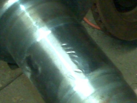 1995 Ford Bronco - A close-up view of a vehicle's axle, showing wear and tear. The Supermotors logo is visible in the corner.