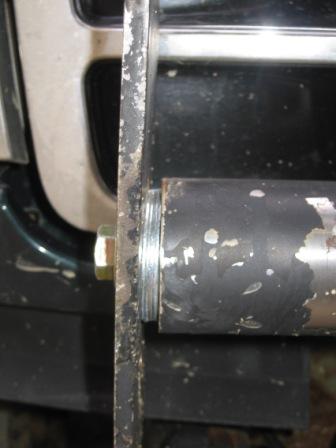 1993 Ford Bronco - A close-up view shows a custom bumper component, a bolt securing metal pieces.