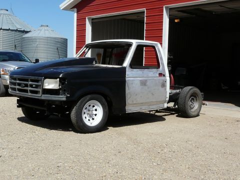 1994 Ford F-150 - This truck is in a state of repair, with mismatched body panels and no interior.