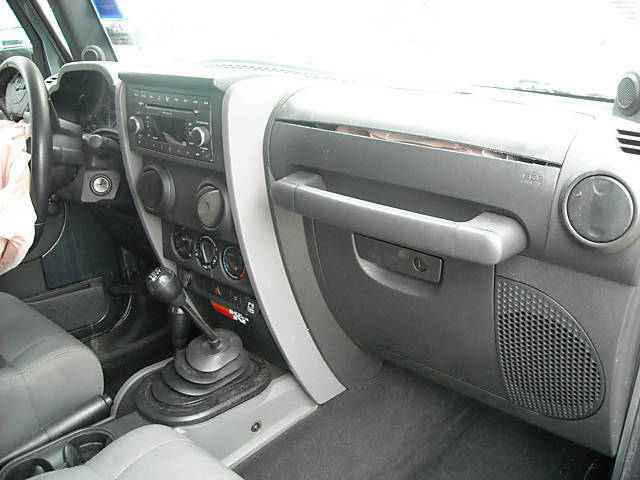 Jeep Wrangler interior with manual transmission and dashboard
