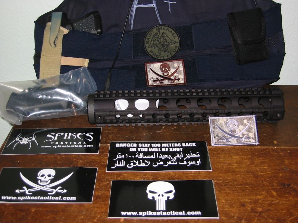Tactical rail, vest, and patches with text warnings