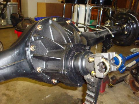 1989 Ford Bronco - Close-up of a rear axle assembly, likely undergoing modification or repair.