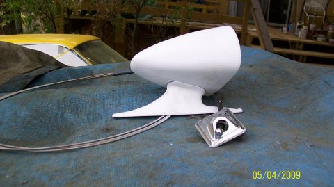 1972 Ford Ranchero - Aftermarket side mirror and mounting hardware laid out on a blue tarp.