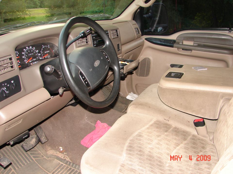 Interior view of a truck showing dashboard, steering wheel, and seats. Watermark reads MAY 11, 2009 SUPERMOTORS.NET