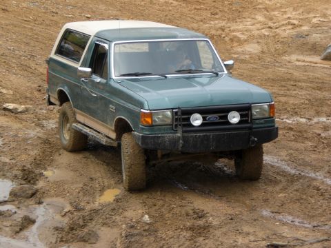 1989 Ford Bronco - This 1989 Ford Bronco navigates a challenging muddy terrain.