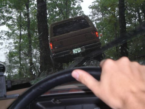 1989 Ford Bronco - Driving a 1989 Ford Bronco through a wet, wooded area.