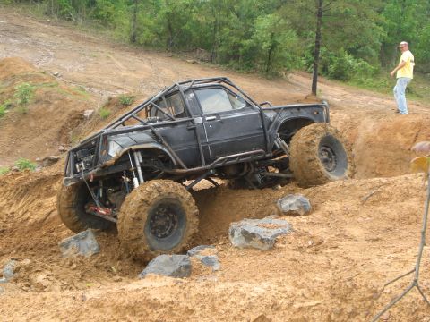 1989 Ford Bronco - A heavily modified truck navigates a challenging off-road course.