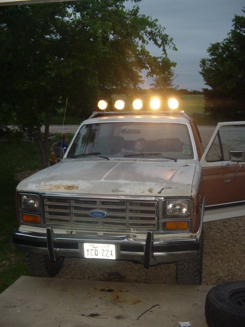 1982 Ford Bronco - This 1982 Ford Bronco features a light bar on the roof and distinctive wood paneling on the doors.