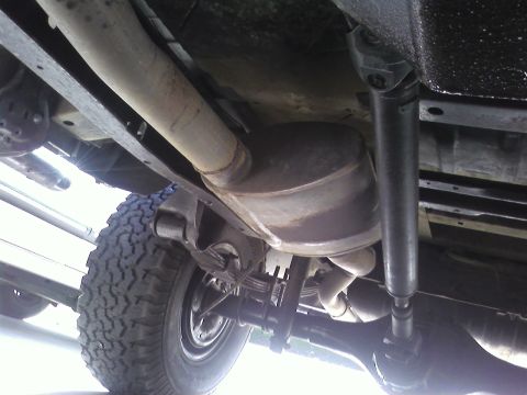 1978 Ford Bronco - This photo shows the undercarriage of a vehicle, including its exhaust and suspension components.