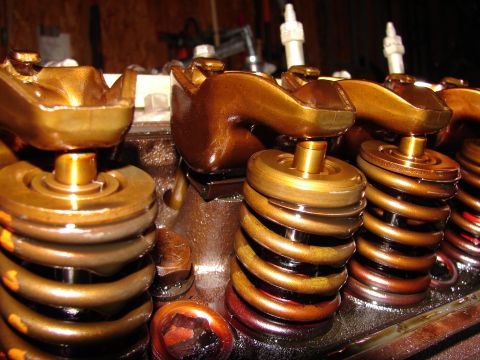 1996 Ford Bronco - Close-up view of engine valve springs and rocker arms, showing metallic components.