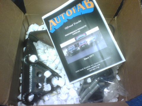 1984 Ford Bronco - A catalog from AutoFab Offroad Trucks is shown inside a box with a vehicle part.
