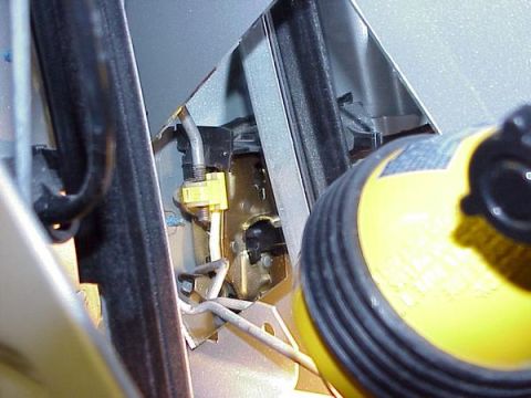 2007 Ford Mustang - Interior view of a car's door latch mechanism, showing internal components and wiring.