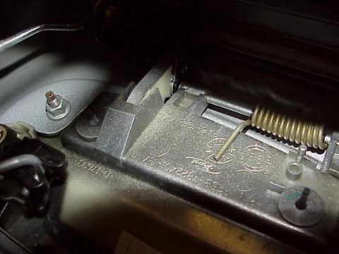 2007 Ford Mustang - Close-up of an interior door latch mechanism, showing the Ford logo and part number 1017692-00.
