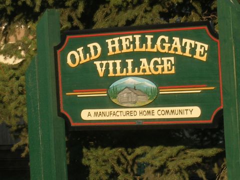 1996 Ford Bronco - A sign indicates Old Hellgate Village is a manufactured home community.