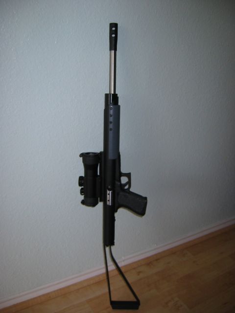 1996 Ford Bronco - This is an air rifle with a scope attached, standing upright against a wall.