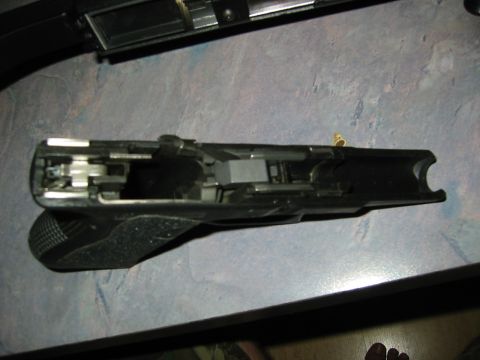 1996 Ford Bronco - The internal components of a disassembled firearm are clearly visible in this close-up view.