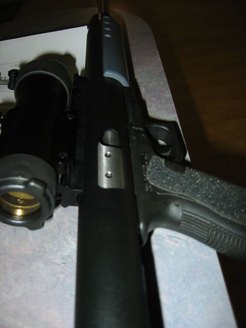 1996 Ford Bronco - A firearm with a mounted scope is shown in detail.