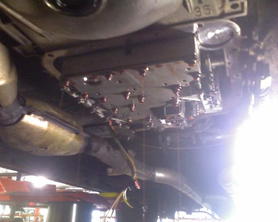 Underside view of a vehicle automatic transmission pan and exhaust