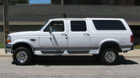 1996 Ford C-350 (Centurion Conversions) - This 1996 Ford C-350 Centurion Conversions SUV is shown from the side, highlighting its extended cab and four-door configuration.