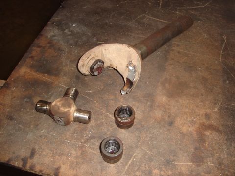1989 Ford Bronco - The image shows a damaged driveshaft yoke and a universal joint, indicating a mechanical failure.