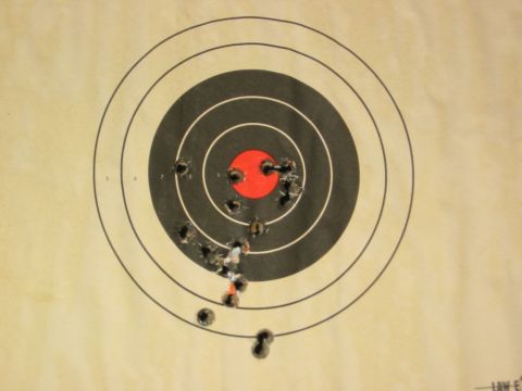 1996 Ford Bronco - A target shows numerous bullet impacts, with most shots clustered near the bullseye.