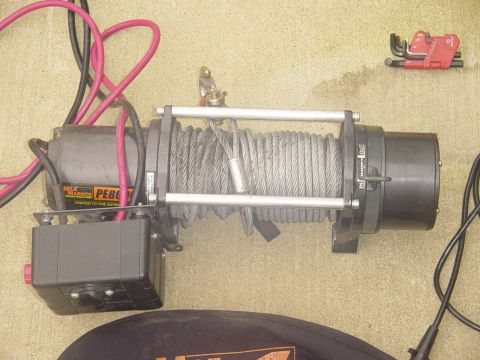 1989 Ford Bronco - Warn PE8000 winch and associated cables are laid out on a concrete surface.