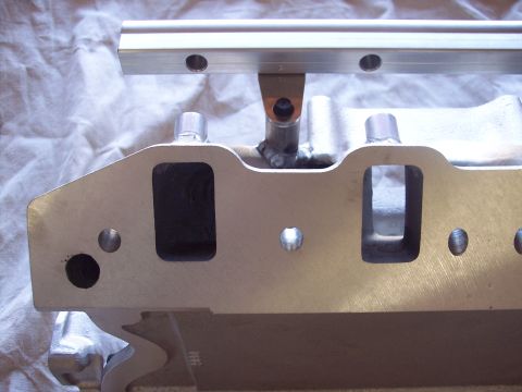 1971 Ford Mustang - This is a close-up view of an engine intake manifold with a fuel rail attached.
